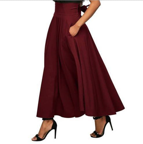Maroon skirt worn by a person on a white background